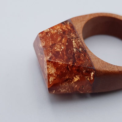Resin ring filled with  copper leaf and wooden base size 57