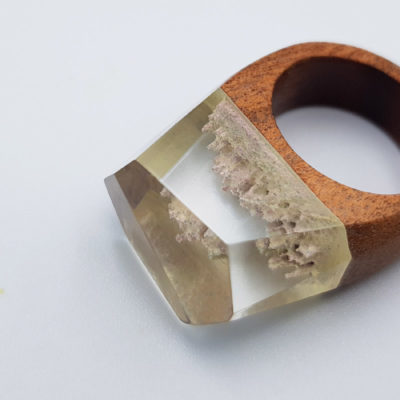 Resin ring in white  with wooden base