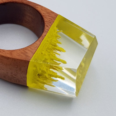 Resin ring in yellow  with wooden base