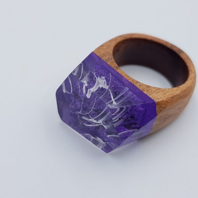 Resin ring in purple and white waves with wooden base