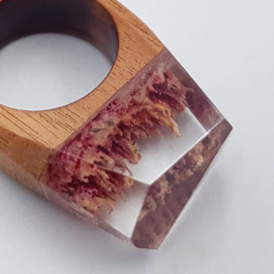 Resin ring in pink and yellow  with wooden base