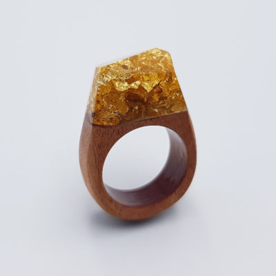 Resin ring filled with precious gold leaf and wooden base size 57