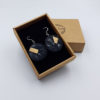 Resin earring, rounds in black color with  wood