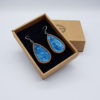 Resin earrings, drops in light blue with wooden bezel