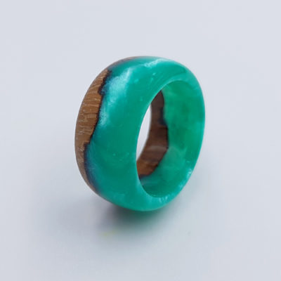 Resin ring in bright green color with wood