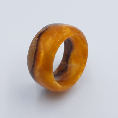 Resin ring in orange  color with wood