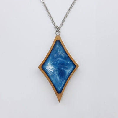Resin necklace small, rhombus in light blue color with wooden bezel