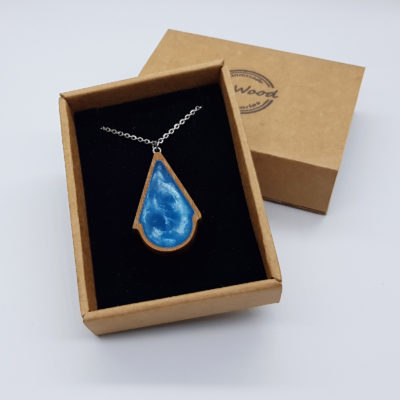Resin necklace small, triangle to round design in light bluewith wooden bezel